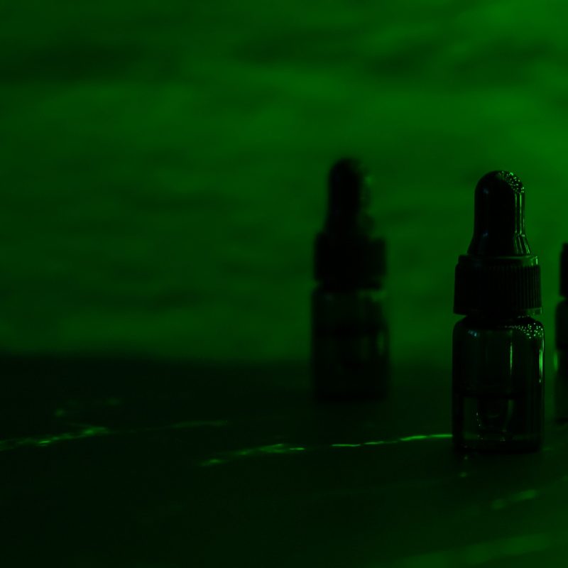 various-glass-bottles-with-cbd-oil-thc-tincture-vape-concept-light-effects-medicinal-cannabis-with_t20_A3NOwP